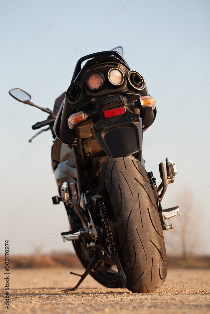 One black motorcycle in the desert. One black motorcycle in the desert.