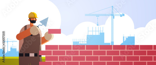 male builder using spatula workman laying brick wall worker in uniform bricklaying building concept construction site background flat portrait horizontal vector illustration