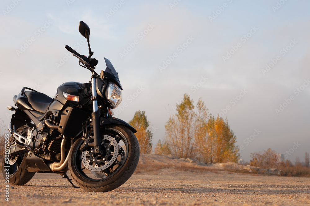 Fototapeta premium One black motorcycle in the desert.