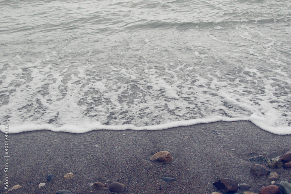 Obraz premium wet stone on sand