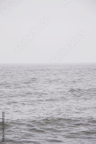 Calm foggy Baltic sea background