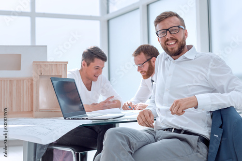 experienced interior designer sitting at his Desk.