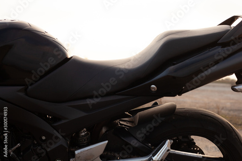 One black motorcycle in the desert.