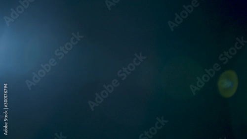 Light leak of blue lens flare in the background photo