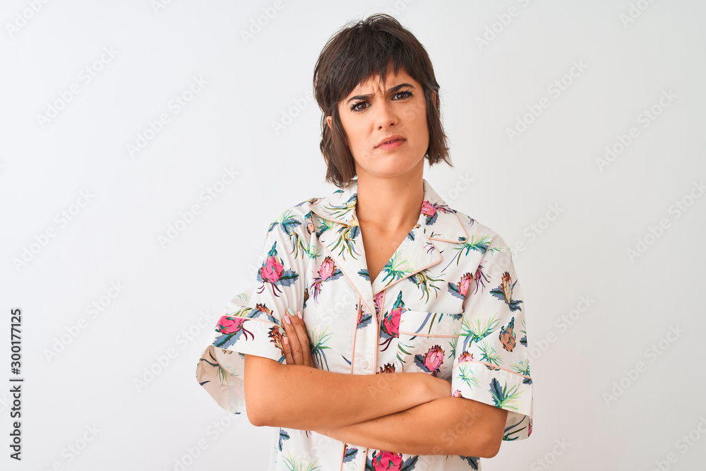 Beautiful woman on vacation wearing summer casual shirt over isolated white background skeptic and nervous, disapproving expression on face with crossed arms. Negative person. Beautiful woman on vacation wearing summer casual shirt over isolated white background skeptic and nervous, disapproving expression on face with crossed arms. Negative person.