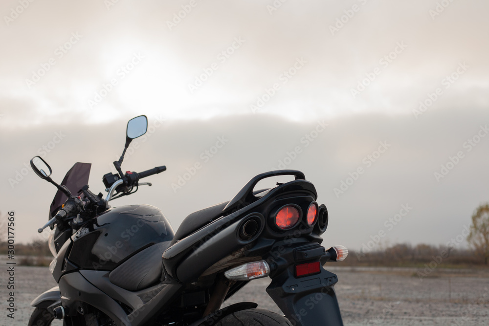 One black motorcycle in the desert. One black motorcycle in the desert.