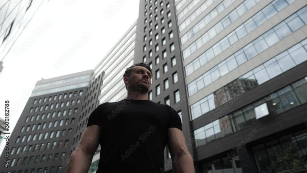 Male athlete on the background of the city.