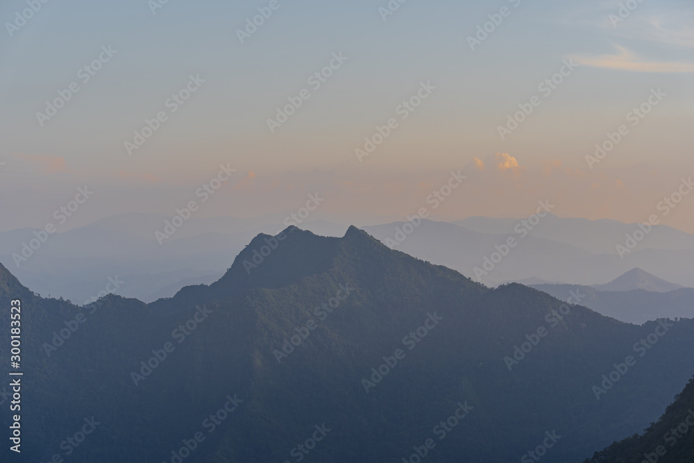 High angle viewpoint sunset over mountains and forest