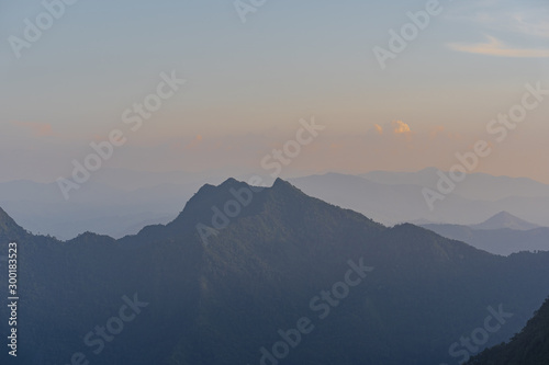 High angle viewpoint sunset over mountains and forest