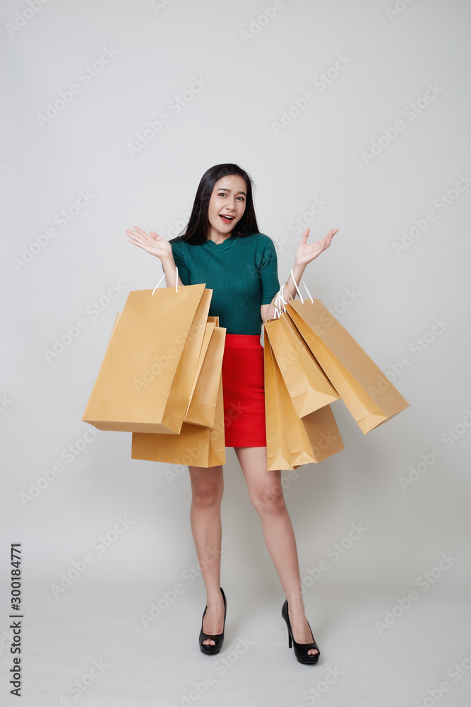 Happy Christmas Asian woman shopping holding paper bags Happy Christmas Asian woman shopping holding paper bags