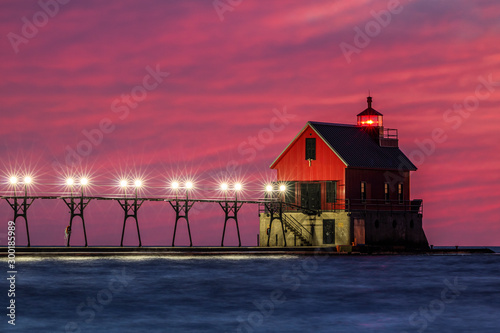 lighthouse at night with catwalk and pier lights © Walter E Elliott