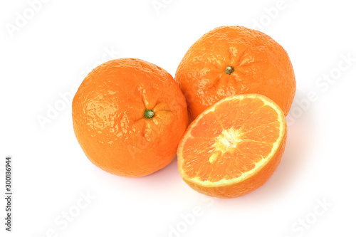 Two tangerines and half isolated on white