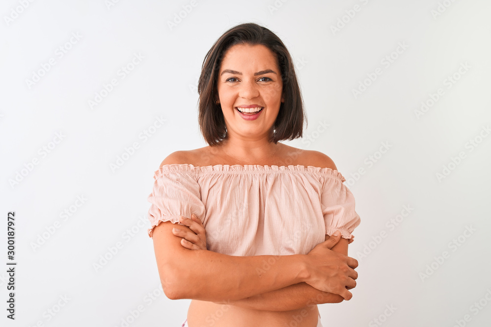 Young beautiful woman wearing casual t-shirt standing over isolated white background happy face smiling with crossed arms looking at the camera. Positive person. Young beautiful woman wearing casual t-shirt standing over isolated white background happy face smiling with crossed arms looking at the camera. Positive person.