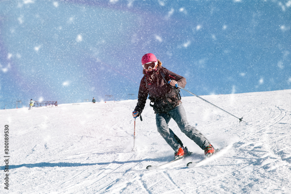 Young skier woman posing for the camera on french slopes