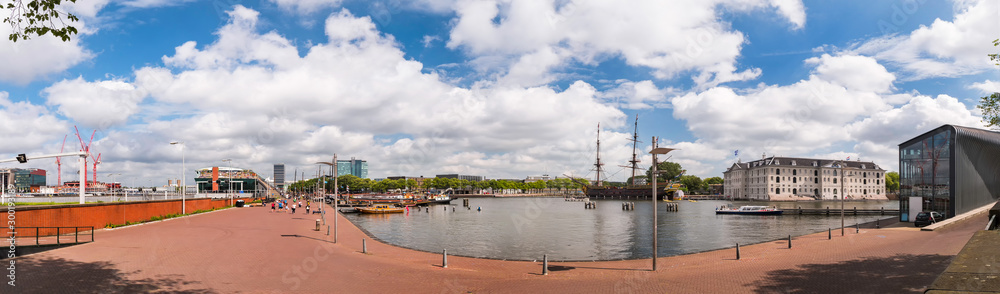Oosterdock, Eastern dock panorama view with the Nemo Science Museum in the background. Amsterdam, the Netherlands cityscape