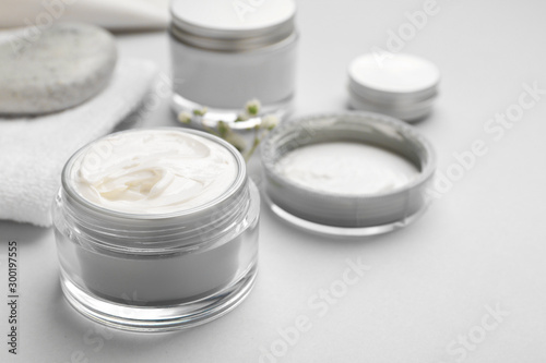 Jar of cosmetic cream on white background