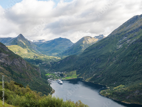View on Geirangerfjord, Norway, one of the most beautiful fjords in the world, included on the UNESCO World Heritage. View from Ornesvingen eagle road viewpoint, early autumn, cloudy day.