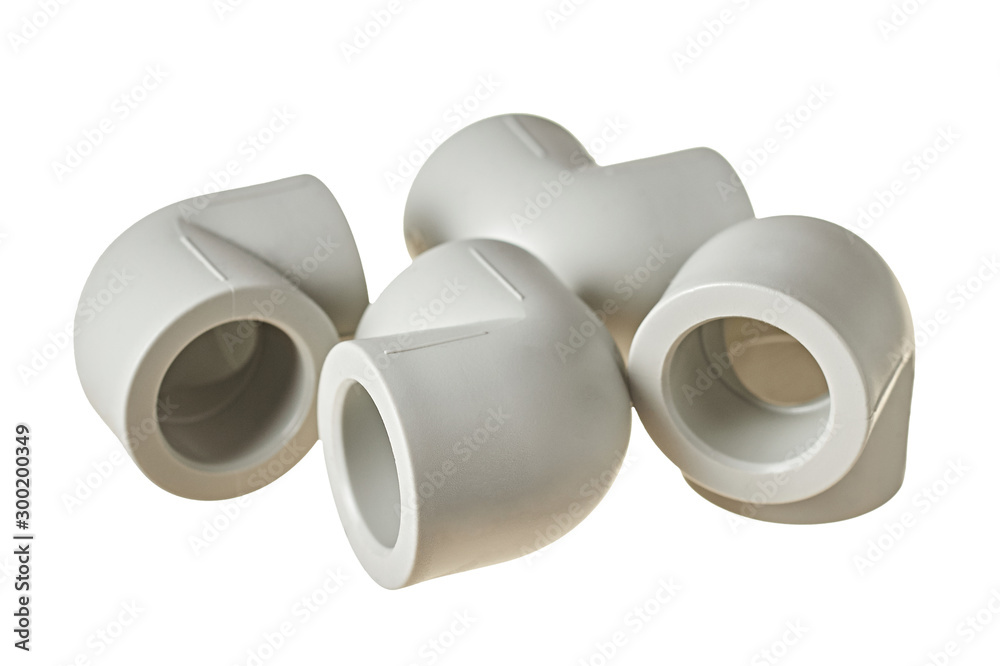 Four polypropylene, plastic corners of 90 degree for connecting pipe for water or other liquid for heating room isolated on white background without shadow. Close-up Four polypropylene, plastic corners of 90 degree for connecting pipe for water or other liquid for heating room isolated on white background without shadow. Close-up