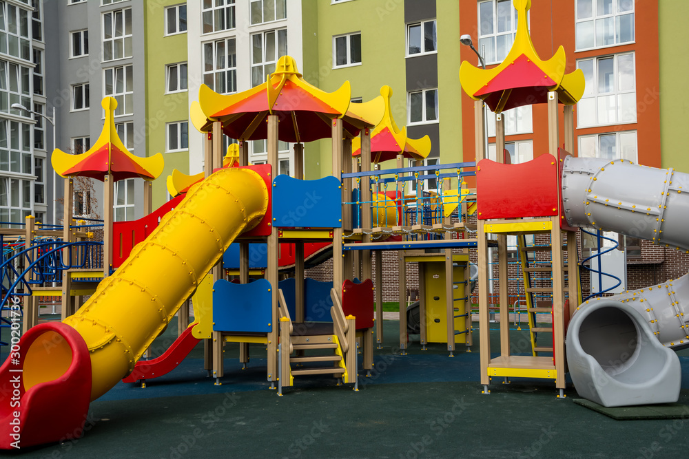 custom made wallpaper toronto digitalChildren's complex of different swings in the courtyard of a multi-storey building. Bright and safe game that can be played by children.