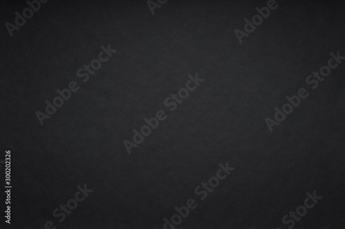 Grain black dark paint wall or black paper background or texture