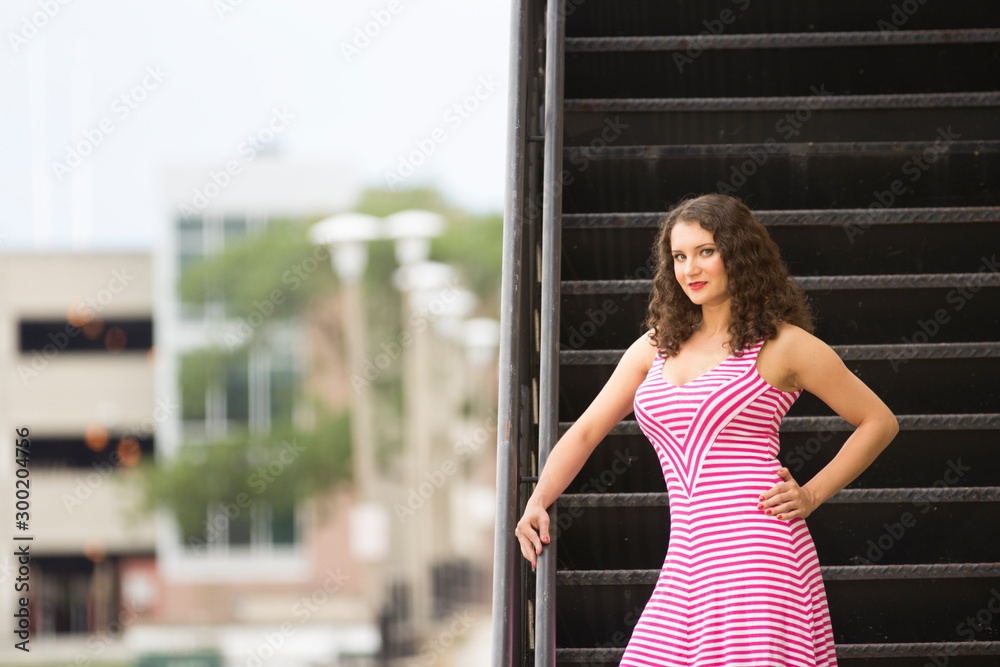 pretty white woman with dress standing on stairs urban pretty white woman with dress standing on stairs urban