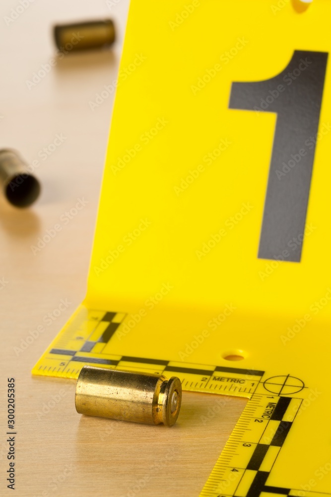 Crime scene investigation CSI evidence marker with empty, fired 9mm ...