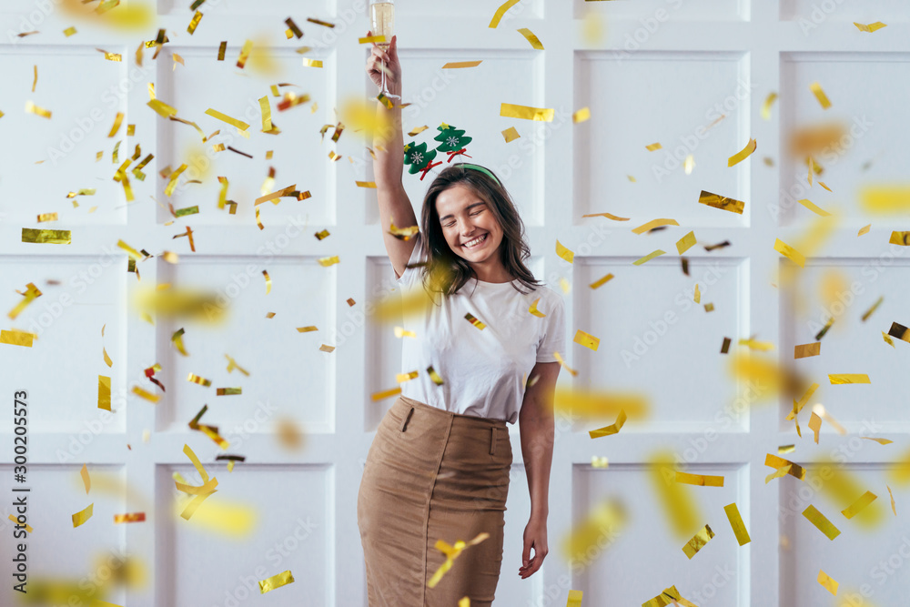 Portrait of young woman with glass celebrate Christmas or New Year - obrazy, fototapety, plakaty 