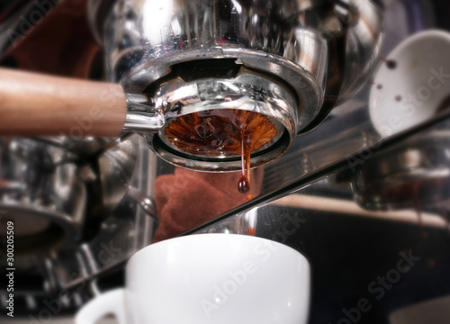 Making espresso coffee in coffeeshop or cafe closeup
