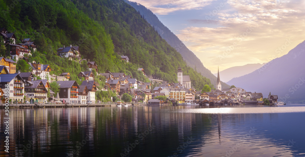 Morning light in Bavarian Alps. And small village and a lake. Sunrise on the lake landmark and travel destination