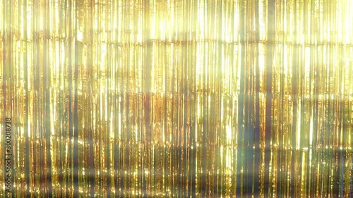 Background layer of dreamy tectured gold metalic tinsel fringe shimmering in the light - static shot canbe looped with copy space photo