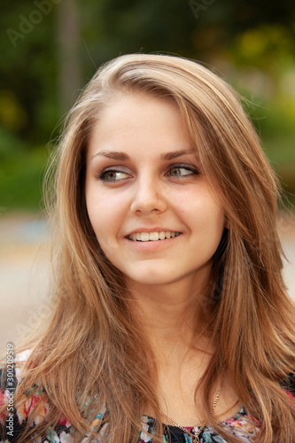 Closeup portrait of a happy young women smiling
