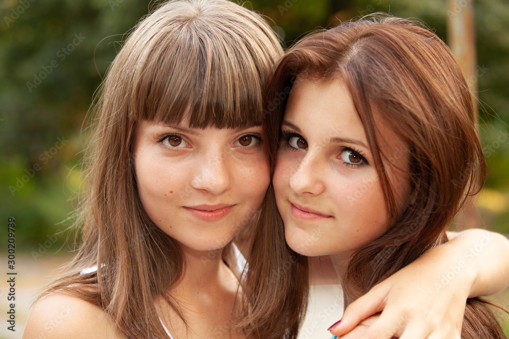 Portrait happy young and attractive girlfriends Portrait happy young and attractive girlfriends