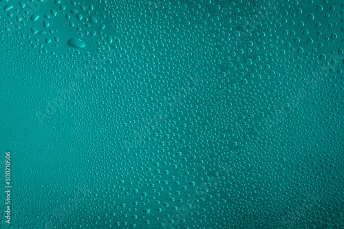 blue water drops on aqua, quetzal green color background