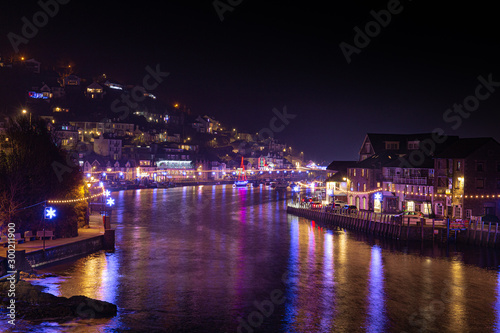 Christmas lights at Looe Harbour on a misty night © Jim Peters