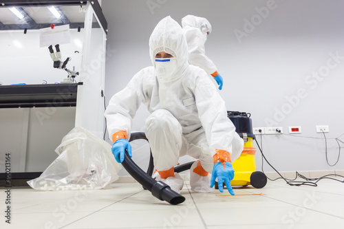 Decontamination of a room after an incident. Practical exercises during a training session on asbestos risk prevention, sample preparation room of an environmental laboratory specialized in asbestos photo