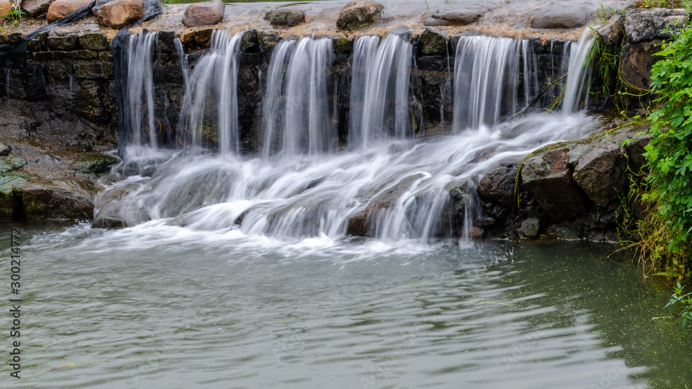 Obraz premium Small waterfall in Songxi village. Pujang county. China