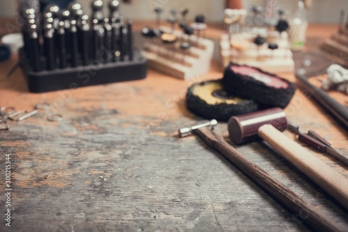 Antique tools for making rings, detail of antique jewelery copyspace goldsmith background