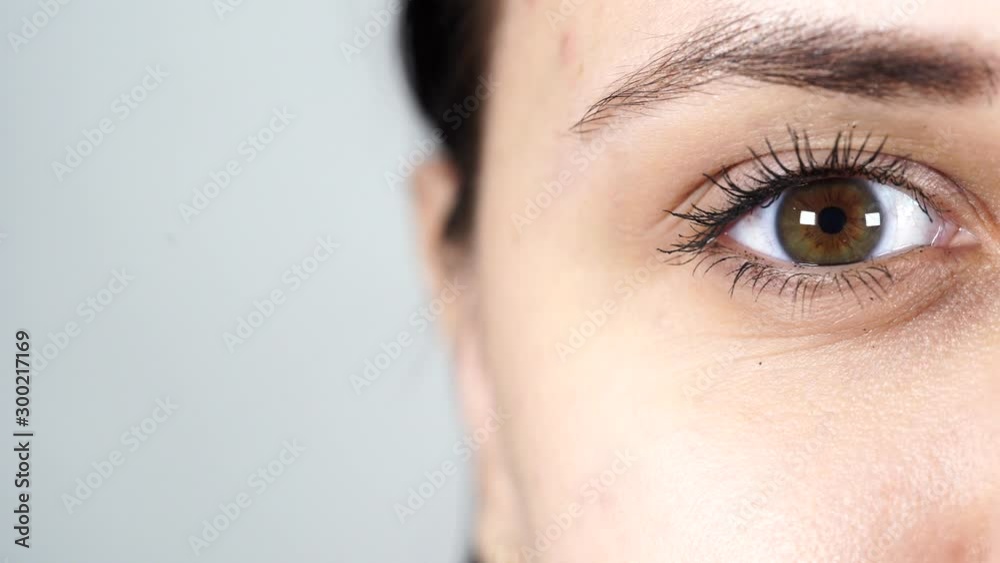 Macro image of human eye with contact lens. Woman's eye close-up. Human eye with long eyelashes with mascara. Cosmetics and makeup. Macro image of human eye with contact lens. Woman's eye close-up. Human eye with long eyelashes with mascara. Cosmetics and makeup.
