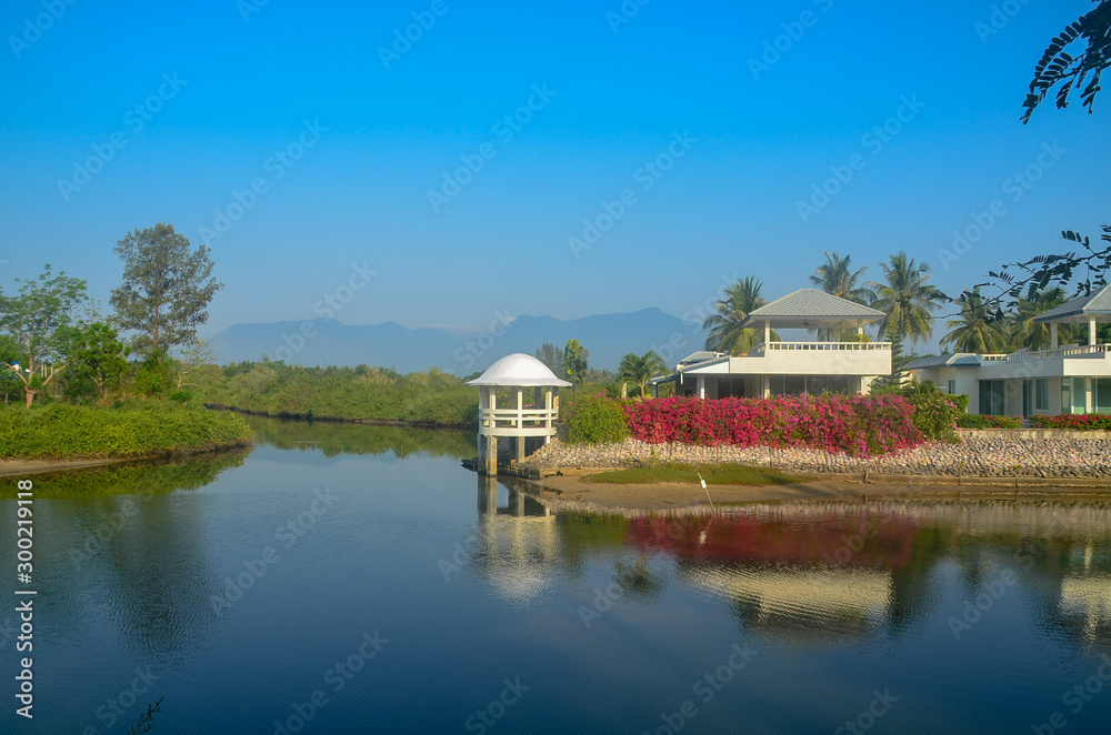 Obraz premium Colourful tropical buildings. Coastal landscape waterscape with