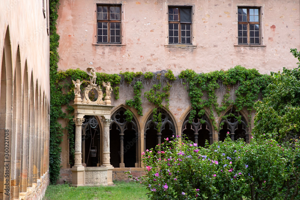 Fototapeta premium Garden of a cloister with a well