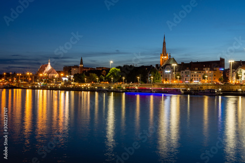 Szczecin in Poland. Light reflections of buildings in the river