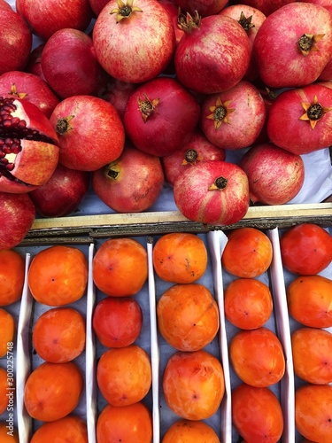 Fresh persimmons and pomegranates on the market