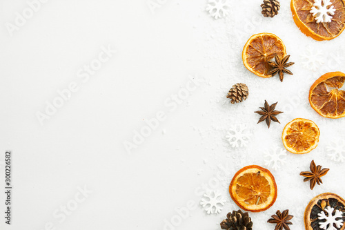 Christmas winter spices. Star anise, orange slices isolated over a white background.