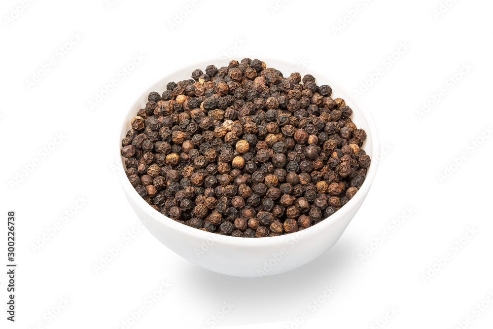 Vibrant black peppercorns in bowl isolated on white background Vibrant black peppercorns in bowl isolated on white background