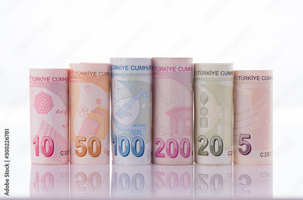 Turkish banknotes. Turkish coins in roll on reflective ground. 5,10,20,50,100 and 200 Turkish banknotes in rolls Turkish banknotes. Turkish coins in roll on reflective ground. 5,10,20,50,100 and 200 Turkish banknotes in rolls