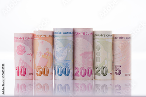 Turkish banknotes. Turkish coins in roll on reflective ground