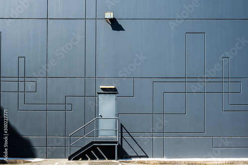 Clean geometric shapes of industrial architecture - back door entrance into warehouse building