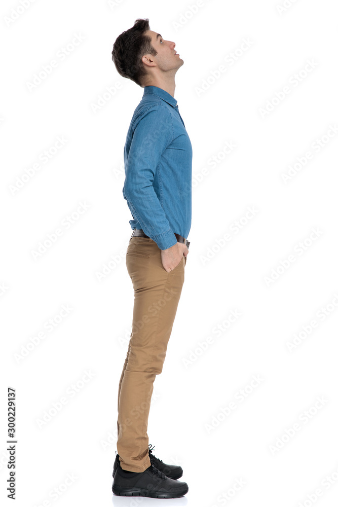 smart casual model looking up and waiting in line smart casual model looking up and waiting in line