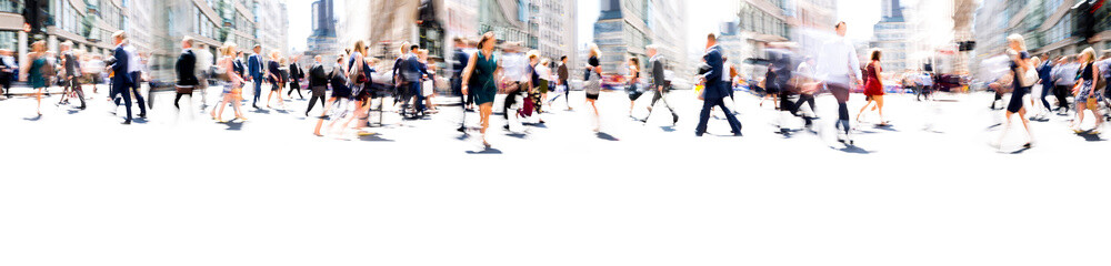 Walking people blur. Lots of people walking in the City of London. Wide panoramic view of people crossing the road. 