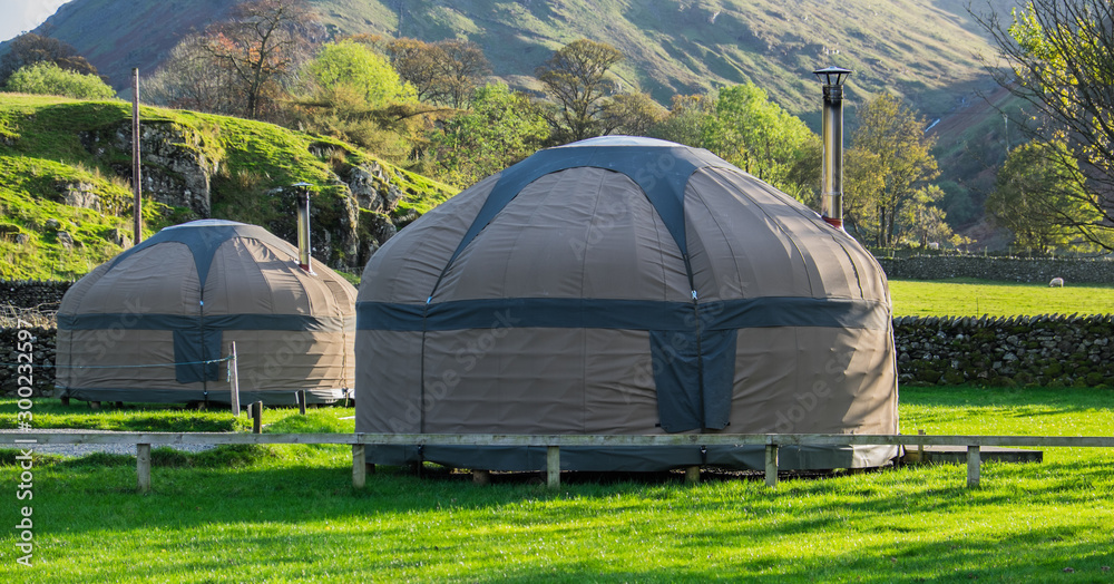 Yurts in a field
